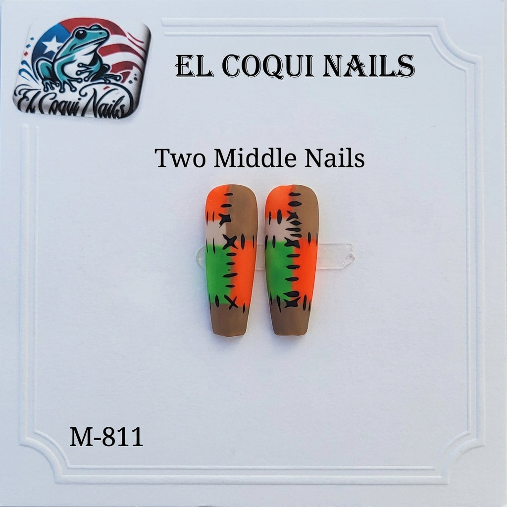 A pair of false coffin-shaped nails displayed on a white card, featuring a Southwestern-style design with a brown base, a green center, and orange-red tips with black geometric details. The brand 'EL COQUINAILS' is visible on a label at the top, and a logo for 'El Coquinails Nails' is in the top-left corner.