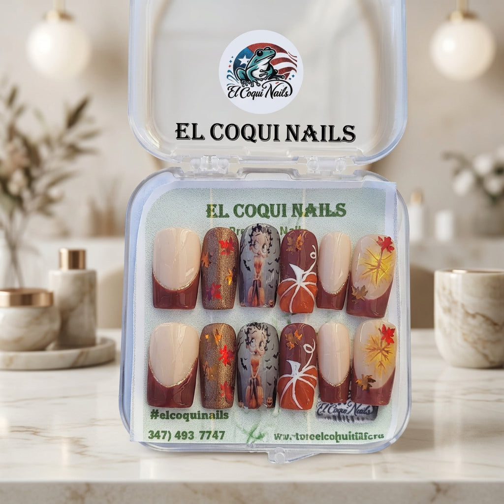A set of 10 decorative press-on nails in a clear plastic clamshell case, labeled EL COQUI NAILS and M-813. The nails feature a mix of solid beige, brown, and fall-themed designs with autumn leaves, pumpkins, and a pumpkin patch illustration.