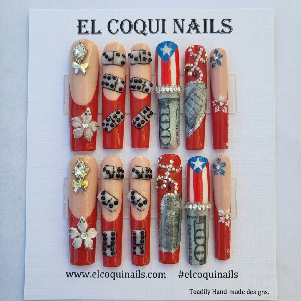 A set of 12 custom press-on nails displayed on a green backing card under the brand name 'EL COQUINAILS'. The nails feature a patriotic American theme with red, white, and blue designs, including stars, stripes, dollar bills, dice, and flowers, embellished with rhinestones.